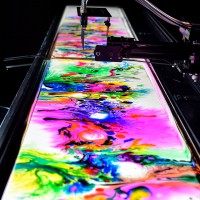 TOKYO, JAPAN - FEBRUARY 08: dyebirth by nor is displayed at the Media Ambition Tokyo at Roppongi Hills on February 8, 2018 in Tokyo, Japan. An installation work that constantly creates organic patterns through digitally controlled chemical reactions of wa
