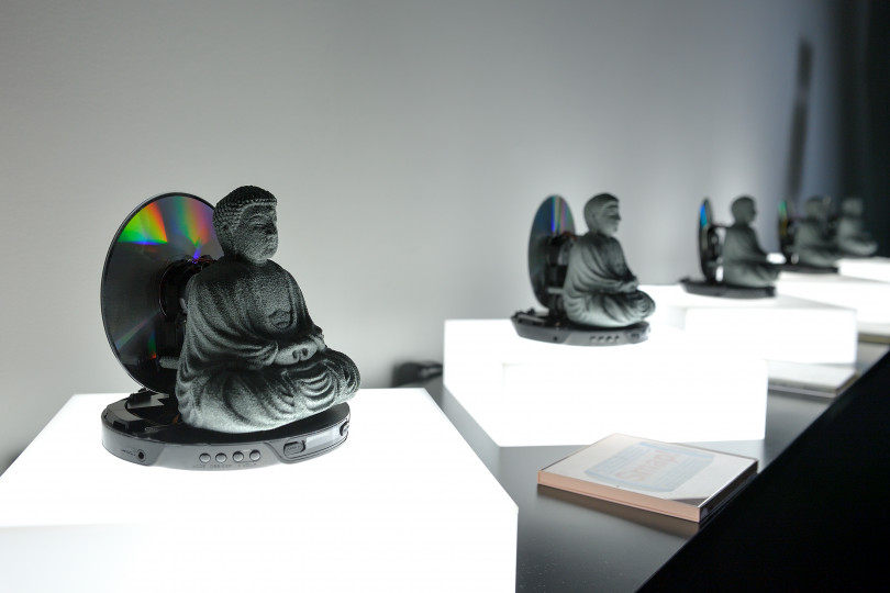 TOKYO, JAPAN - FEBRUARY 08: CD Prayer by Yuichiro Katsumoto is displayed at the Media Ambition Tokyo at Roppongi Hills on February 8, 2018 in Tokyo, Japan. Artwork details. CD Prayer is a Buddha statue designed to previve CD music. The CD will work as a h