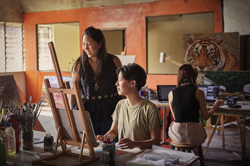 KENZO's Carol Lim and artists ideating in a studio in Cambodia